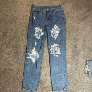 size large holed jeans. baggie fit.